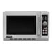A stainless steel Amana commercial microwave with a black digital display.
