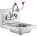 A Regency wall-mounted stainless steel hand sink with faucet and eyewash station.