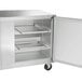 A Traulsen stainless steel undercounter freezer cabinet with left and right hinged doors open.