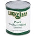 A can of Lucky Leaf peach cobbler filling on a counter.