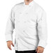 A man wearing a white Uncommon Chef long sleeve chef coat with mesh back.