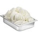 A metal container with white Fabbri Nevepann gelato base with white swirls.