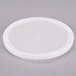 A white plastic lid with a circle.