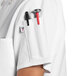 A white Uncommon Chef short sleeve chef coat with side vents.