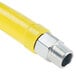 A yellow T&S gas appliance connector hose with a silver metal quick disconnect nut.