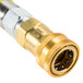 A gold T&S Safe-T-Link gas appliance connector hose with a yellow quick disconnect.