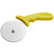 A Choice yellow pizza cutter with a yellow handle.