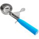 A metal scoop with a blue handle.