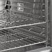 A stainless steel Main Street Equipment double deck convection oven with metal racks.