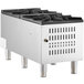 A stainless steel Cooking Performance Group natural gas stock pot range with four burners.