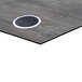 A gray square BFM composite laminate table top with a black circle and a white circle inside it.