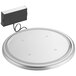 A round stainless steel platform with a black cord.