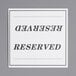 A white rectangular Choice table tent sign with black text that says "Reserved"