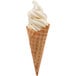 A waffle cone filled with vanilla soft serve ice cream with a white swirl.