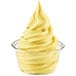 A glass container of yellow DOLE Lemon Soft Serve.