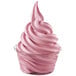 A clear cup of DOLE Soft Serve raspberry ice cream with a swirl on top.