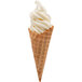 A waffle cone filled with soft serve vanilla frozen yogurt with a white swirl.