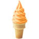 An orange soft serve ice cream cone.