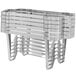 A stack of Vollrath silver metal chafer racks with a handle.