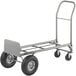 A silver metal hand truck with black wheels.