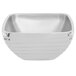 A silver stainless steel square Vollrath serving bowl.