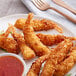 A plate of Handy Coconut Breaded Shrimp with dipping sauce.