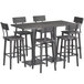 A Lancaster Table & Seating live edge bar height table with bar chairs and a stool.