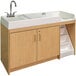 A maple laminate walkup changing table with a left side sink above a maple cabinet.