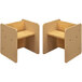 A pair of beige and maple wooden activity cubes with chairs.