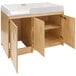 A natural birch plywood infant changing table with two doors.