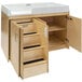 A natural birch wood toddler changing table with two drawers.