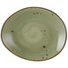 A white Tuxton china ellipse plate with a green geode swirl design.