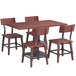 A Lancaster Table & Seating mahogany dining table and chairs with a live edge.