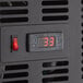A digital display with numbers on the black control panel of an Emperor's Select Countertop Refrigerated Sushi Display Case.