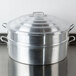 A Town aluminum steamer pot with lid and handles.