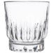A clear Libbey Winchester rocks glass with a patterned design.
