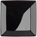 A black square Acopa stoneware plate.