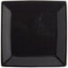 A black square stoneware plate with a black border.