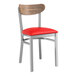 A Lancaster Table & Seating chair with red vinyl seat and vintage wood back.