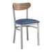 A Lancaster Table & Seating chair with a navy cushion and vintage wood back.