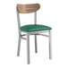 A Lancaster Table & Seating Boomerang chair with a green vinyl seat.
