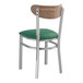 A Lancaster Table & Seating Boomerang Series chair with a green vinyl seat.