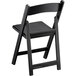 A black Lancaster Table & Seating folding chair with a black seat.