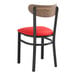 A Lancaster Table & Seating black chair with red vinyl seat.