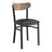 A Lancaster Table & Seating black wood chair with a black vinyl seat and vintage wood back.