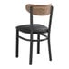 A Lancaster Table & Seating black wood chair with black vinyl cushion.