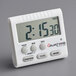 A white digital clock with a timer on it.