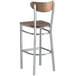 A Lancaster Table & Seating Boomerang series metal bar stool with a wooden seat and back.
