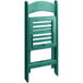 A green resin folding chair with a slatted seat and back.