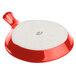 A red and white Tuxton fry pan server with a white lid.